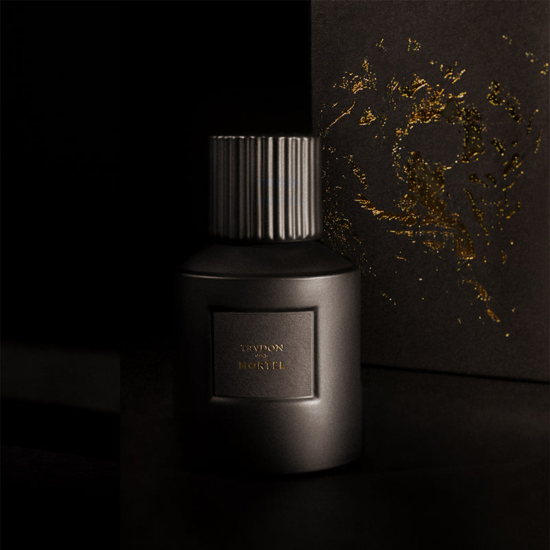 Cire Trudon | Mortel Noir Perfume | Lifestyle Image of Perfume Bottle, Black Background